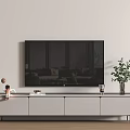 TV Mounted Above Light Gray TV Stand with Decorative Items Books and Potted Plant