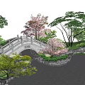 Stone Arch Landscape Bridge With Cherry Blossom Trees Green Vegetation And Sunset Sky