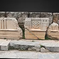 Ancient Stone Carved Architectural Elements With Intricate Floral And Geometric Motifs