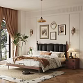 Double Bed with Black Leather Headboard White Floral Sheets and Wooden Nightstand