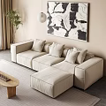 Cream Sectional Sofa With Cushions In Modern Living Room With Abstract Art And Potted Plant