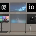 TV Screens Showing Digital Clock Windows Interface And Colorful Icons On Black Silver Portable Stands