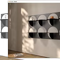 Modern Minimalist Black Wall Mounted Shelf With Circular Compartments And Decor Pieces
