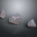 Natural Stone Pieces Featuring Different Sizes Pink Purple Hue and Textured Surfaces