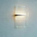 Modern Transparent Glass Wall Light With Sleek Metal Accent And Soft Lighting