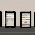 Four Black Wine Coolers Containing Various Wine Bottles And Boxes In Front Of Light Wall