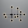 Modern Wall Lamp With Black Metal Frame And Illuminated Circular Lights Mounted On White Wall