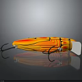 Insect Shaped Fishing Lure With Orange Yellow Body Black Stripes Hooks And Shiny Reflective Surface