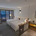 Modern Hotel Guest Room With Twin Beds Mountain View Large Windows And Vanity