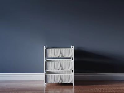 White Three Tier Storage Shelf Unit With Fabric Bins Against Navy Wall And Wood Floor 3d model