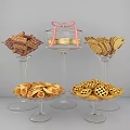 Assorted Cookies And Pastries On Glass Pedestal Trays With Pink Bow Decoration