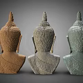 Three Buddha Head Sculptures Intricately Carved With Varied Colors And Classic Features