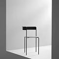 Modern Minimalist Dining Chair With Black Frame And Sleek Metal Legs Design