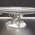Elegant Ornate Coffee Table With Carved Wooden Top And Intricate Metal Base