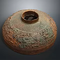 Ancient Bronze Vessel With Intricate Carved Patterns And Traditional Sculptural Design