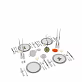 Elegant Modern Dinnerware Set With Glass Plates Cups Utensils And Decorative Accents