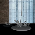 Silver Water Drop Sculptures with Dripping And Splashing Forms Against Grid Curtain And Dark Wall