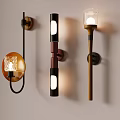 Lit Wall Lamps With Different Designs On Light Colored Wall Various Shapes Materials Transparent Shades