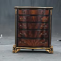 Classic Dark Wooden Chest of Drawers With Gold Accents Ornate Handles And Carved Legs