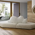 Plush Cream Two Seater Sofa In Bright Room With Large Window And Wooden Wall
