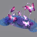 Vibrant Purple And Pink Butterfly Art Installation With Decorative Stems And Blue Base