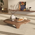 Oval Wooden Coffee Table With Unique Base Vase Dried Branches Open Book And Fruit Tray