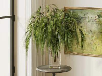 Transparent Vase With Green Cascading Plants On Round Metal Table In Room 3d model