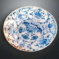 Blue and White Porcelain Plate Adorned With Floral Plant Patterns And Detailed Designs