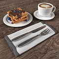 Waffles With Chocolate Sauce Blueberries On White Plate Coffee And Cutlery On Napkin Wooden Table