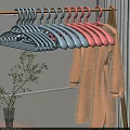 Beige Fluffy Coat on Colorful Hangers with Plant and White Railing