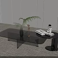 Modern Black Coffee Table with Decorative Items Vase Sculpture and Green Plant on Minimalist Rug