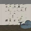 White Modular Bookshelf With Compartments Books Plants Next To Blue Beanbag Chair On Wooden Floor