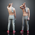 Shirtless Man Wearing Gray Sweatpants and Red Sneakers with Towel on Shoulder Holding Water Bottle