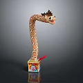 Spotted Giraffe Toy with Long Neck Popping Out of Colorful Box on Black Background