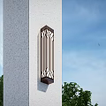 Exterior Vertical Wall Sconce With Black Grille On White Textured Wall And Green Trees