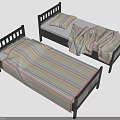 Two Twin Beds With Black Frames And Colorful Striped Bed Sheets And Blankets