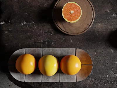 Fresh Ripe Grapefruits Arranged On Ceramic Tray And Wooden Plate 3d model