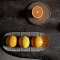 Fresh Ripe Grapefruits Arranged On Ceramic Tray And Wooden Plate
