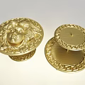 Golden Brooch With Carved Female Head And Chain Border Showing Back Design Details