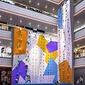 Indoor Rock Climbing Wall In Shopping Mall With Colorful Holds And Geometric Patterns