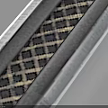Antique Metal Sword With Ornate Hilt And Patterned Blade On Light Blue Background