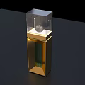 Modern Golden Decorative Display Case With Transparent Glass Cover And Small White Object Inside
