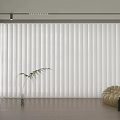 White Vertical Blinds in Modern Laundry Room with Beige Sofa Chair Green Plant and Side Table