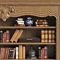 Classic Wooden Bookcase With Carved Top And Shelves Filled With Books Vases And Decorative Items