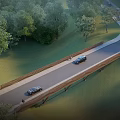 Scenic Wooden Landscape Bridge Surrounded by Green Trees and Lush Grass Under Clear Blue Sky