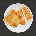 Crispy Two Slices of Toast on White Plate with Silver Butter Knife
