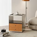 Modern Bedside Table With Glass Top Wooden Drawer And Floor Lamp Near Sofa