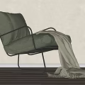 Light Green Fabric Accent Chair with Black Metal Frame and White Throw Blanket