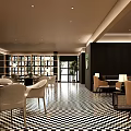 Elegant Modern Restaurant Interior With Checkered Floor Comfortable Seating And Warm Lighting