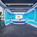 Modern Radio Studio With FM1058 Logo Blue Background Desk Cameras Green Plant And LED Lights
